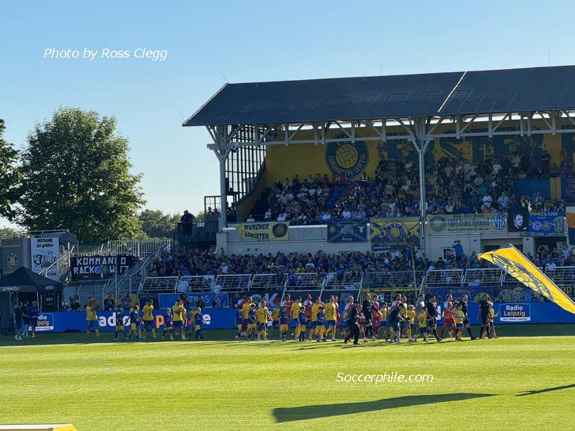The teams take to the field.