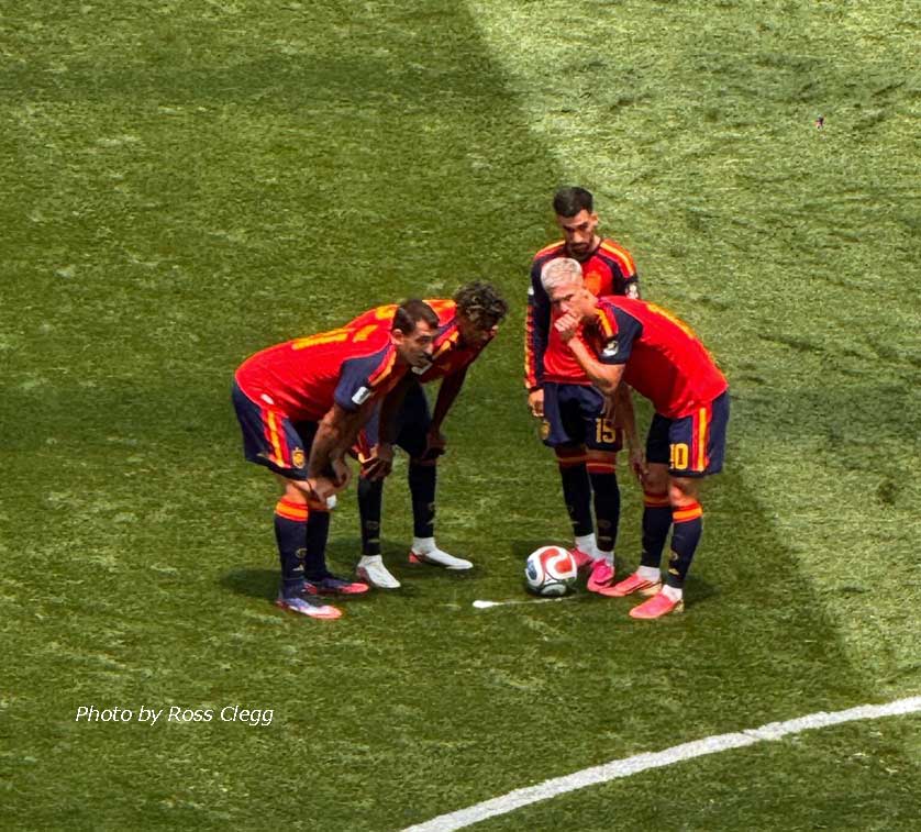 Spain ponder a free kick.
