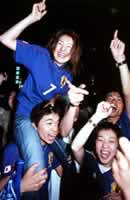 Japanese fans celebrate.