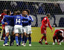 Japan downs Bahrain 1-0.