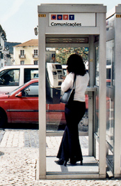 Woman in telephone box.
