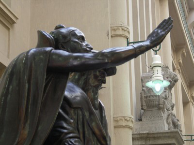 Mephisto talking to Faust in the Maedler Passage in the center of Leipzig by Lars Gohler.